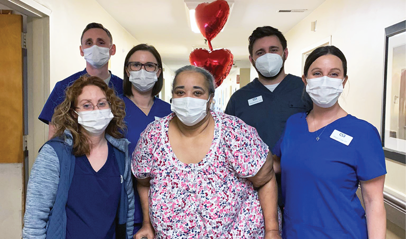 Bowling Green resident Ms. Barber pictured with group of male and female staff members